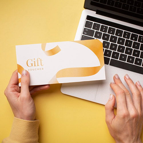 Image of a woman holding a gift card