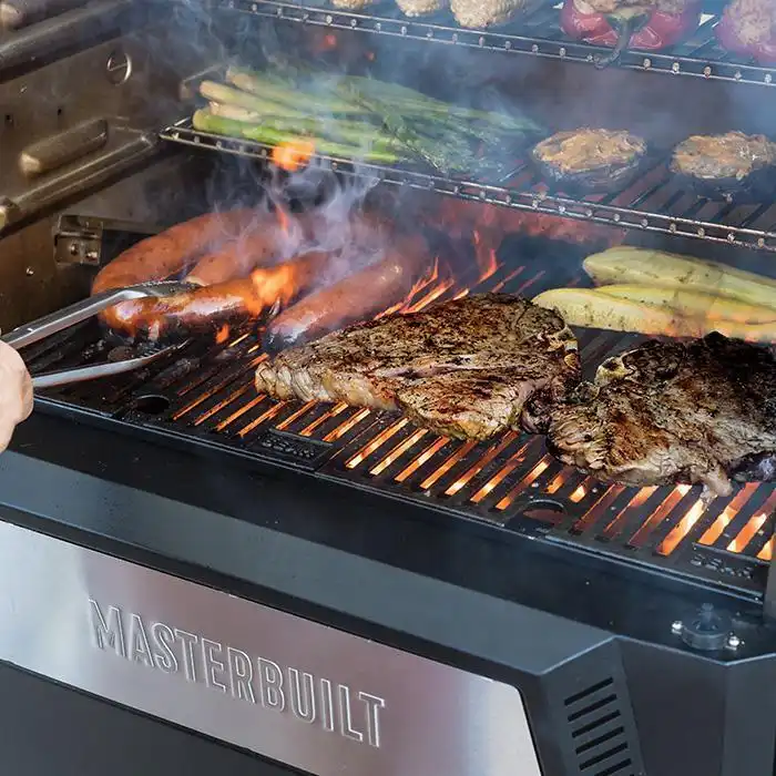 Image of smoking meat in a bbq grill 